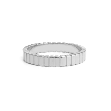 Silver ring with a hexagonal pattern on a white background