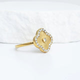 Gold Floral Motif Ring with a floral design on a white background