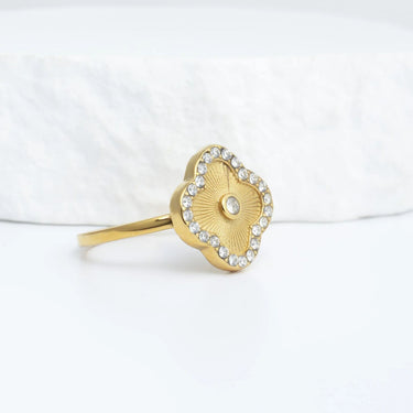 Gold Floral Motif Ring with a floral design on a white background
