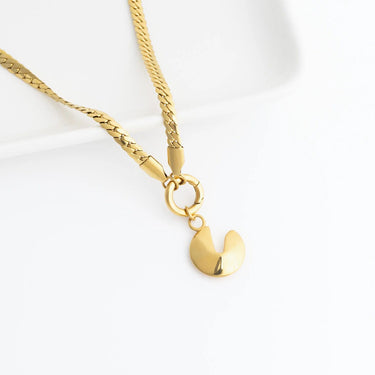 Gold necklace with a Fortune Cookie Charm on a white background