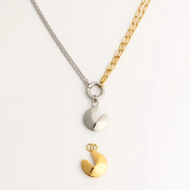 Spilt chain  necklace withgold and silver Fortune Cookie Charms on a light gray background