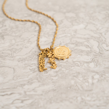 Blessed Charm w/other charms on Singapore Necklace