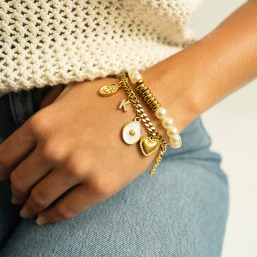 White Enamel Charm with Shell, On curb chain bracelet, with other charms, with stretch pearl bracelet