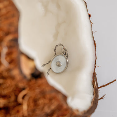 White Enamel Charm with Shell, on curb Singapore bracelet