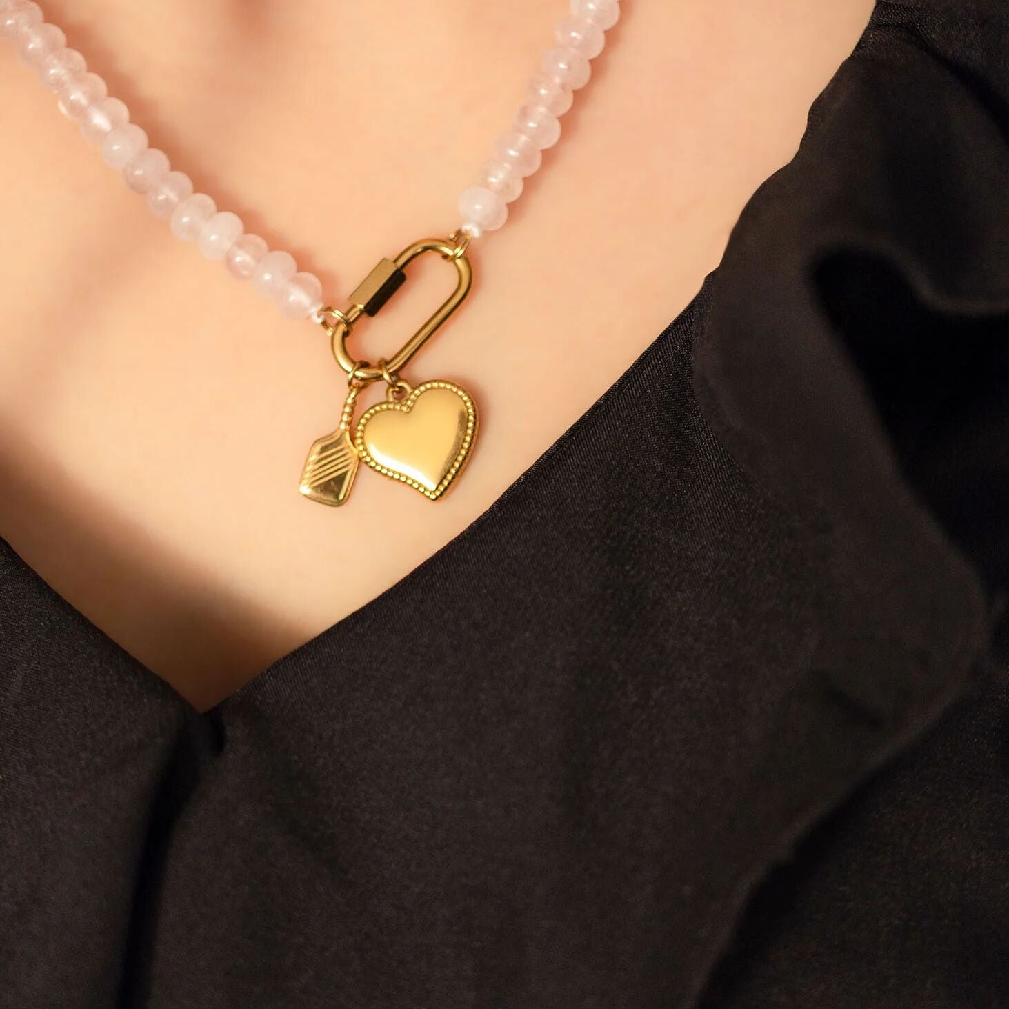 Necklace with a gold heart pendant on a black background