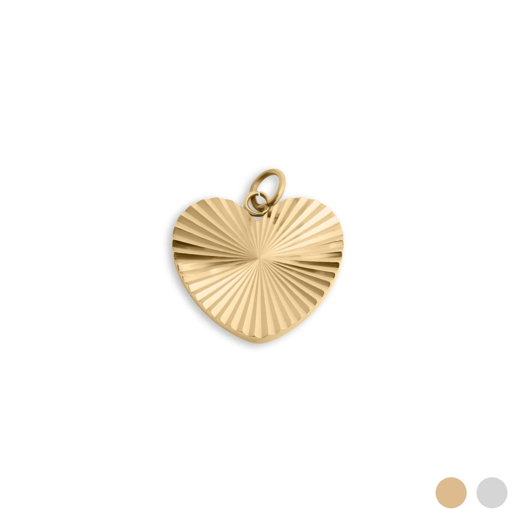 Gold heart-shaped pendant with textured surface on a white background