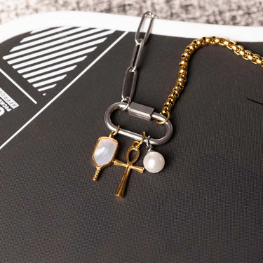 Bracelet with charms on a black surface