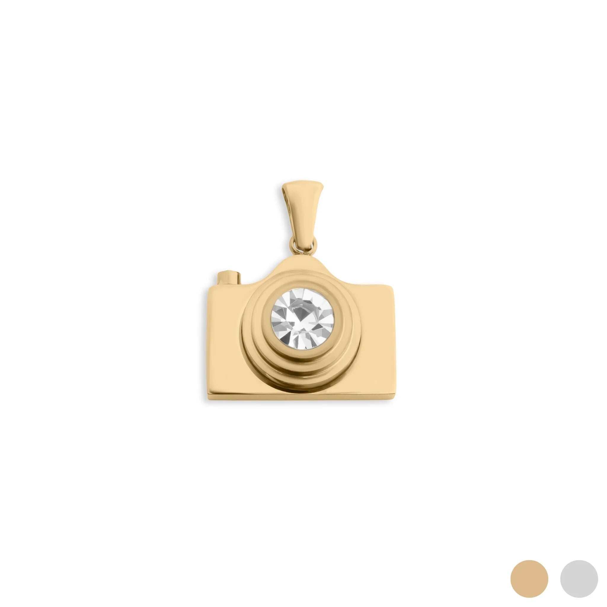 Gold camera-shaped pendant with a central gemstone on a white background
