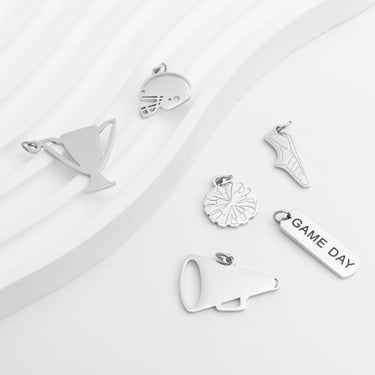 Collection of silver charms on a white background