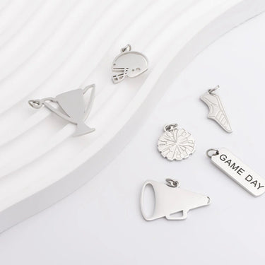 Collection of silver pendants on a white background