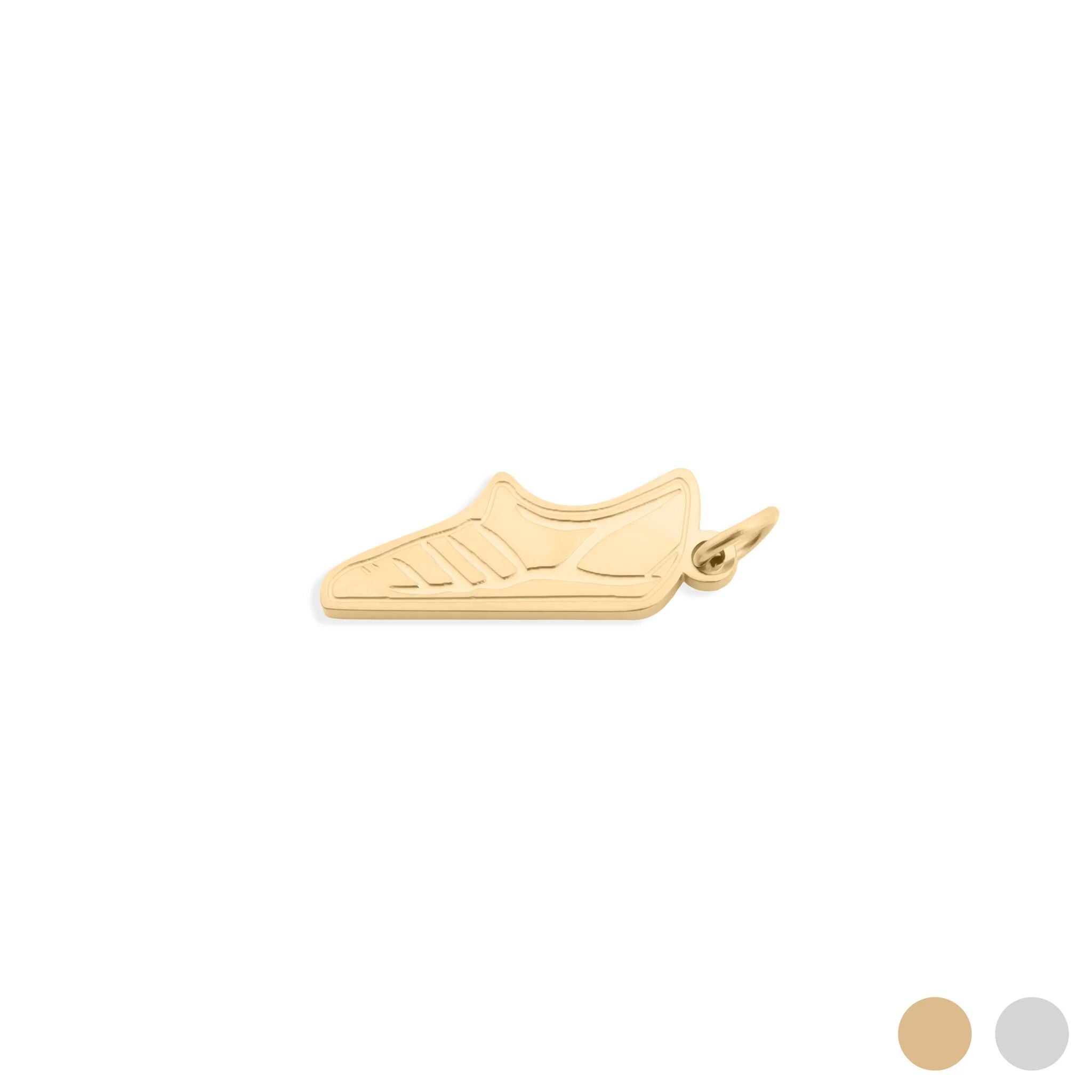 Gold shoe-shaped pendant on a white background