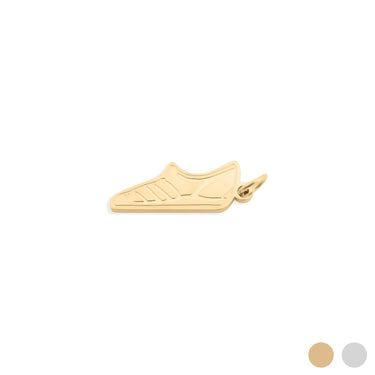 Gold shoe-shaped pendant on a white background