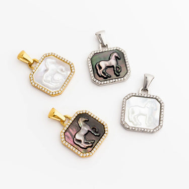Four decorative pendants with horse designs on a white background