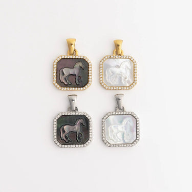 Four horse-themed pendants on a white background