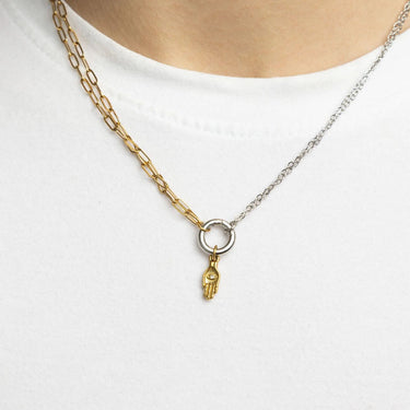 Two necklaces with charms on a white background