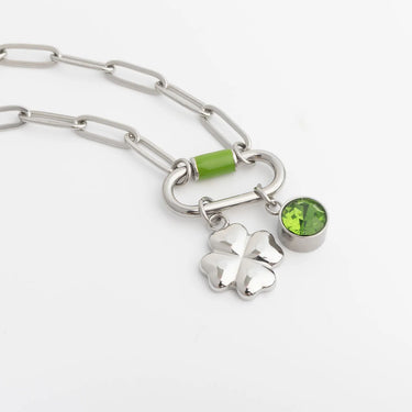 Silver colorful carabiner necklace with a clover charm on a white background