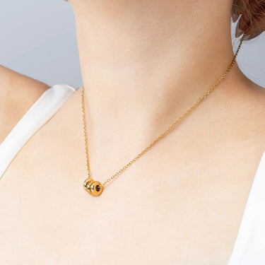 Gold Rounded Spacer Beads on necklace 