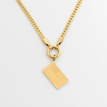 Gold necklace with a Flag Charm  on a light gray background