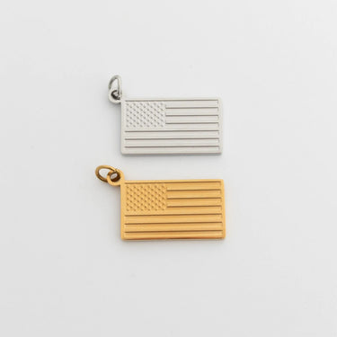 Gold and silver American flag pendants on a light gray background