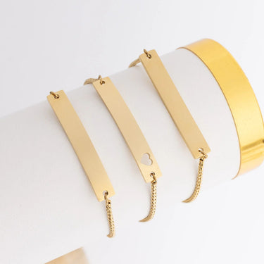 Gold bracelets with different designs on a white background