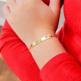Box chain bracelet with horizontal bar charm with heart engraving lifestyle