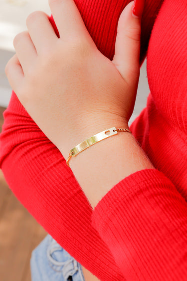 Box chain bracelet with horizontal bar charm with heart engraving lifestyle