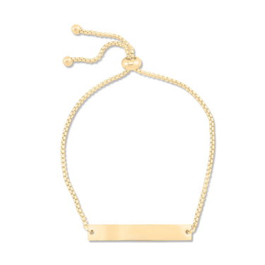 Gold bracelet with a bar clasp on a white background