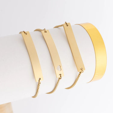 Set of gold necklaces on a white background