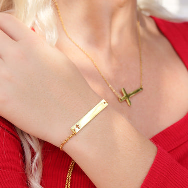 Rope chain bar bracelet with Christian cross engraving to the right of the bar