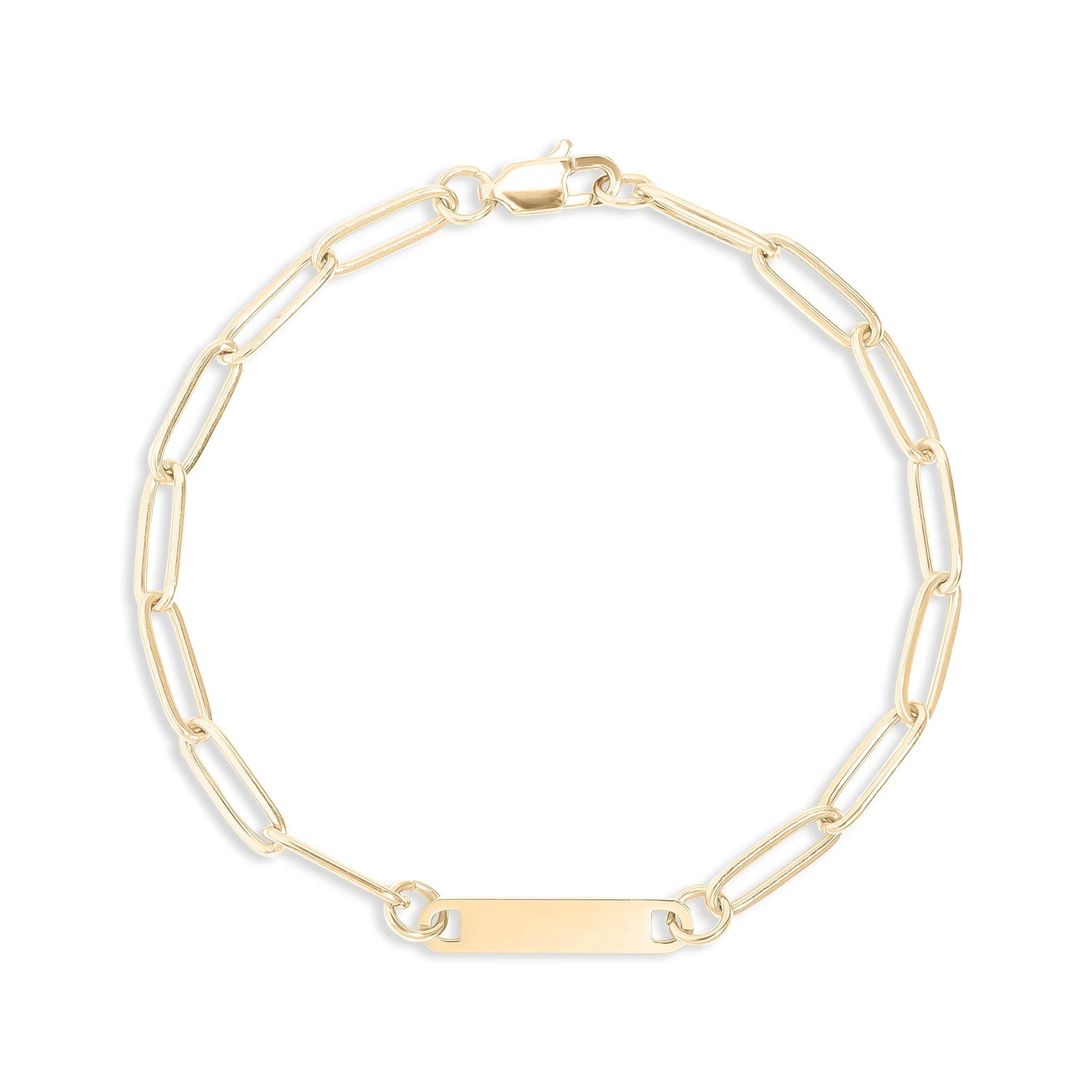 Gold chain bracelet with a nameplate on a white background