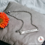 Blank Curved Bar Bracelet/Anklet with an engraving that says "miracle" in a cursive font