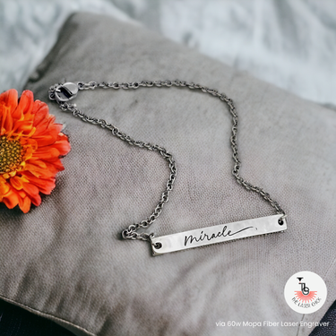Blank Curved Bar Bracelet/Anklet with an engraving that says "miracle" in a cursive font