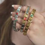 Wholesale jewelry collection: Stainless cherry, stainless connector, stainless best friends, stainless birthstone, stainless yin and yang. Gold double heart, gold basketball, gold full heart, gold cross, gold birthstone, gold connector, gold clover and gold initial charms 