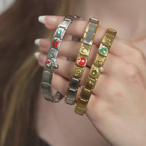 Wholesale jewelry collection: Stainless cherry, stainless connector, stainless best friends, stainless birthstone, stainless yin and yang. Gold double heart, gold basketball, gold full heart, gold cross, gold birthstone, gold connector, gold clover and gold initial charms 