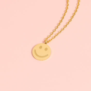 smiley face charm on a chain