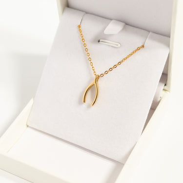 Gold Wishbone Charm on Chain in jewelry box