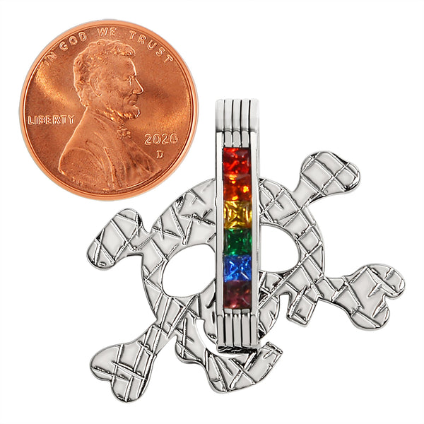 Stainless steel Cubic Zirconia skull and crossbones rainbow pendant with a penny for scale.