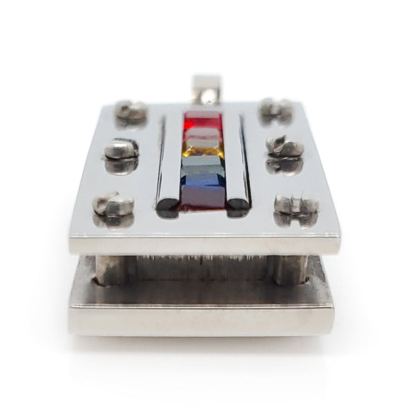 Stainless steel cubic zirconia rainbow rectangle pendant at an angle.