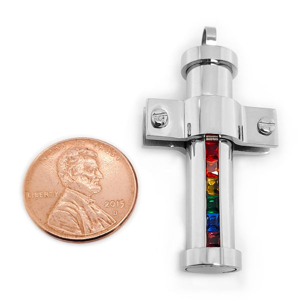 Stainless steel Cubic Zirconia rainbow pride pendant with a penny for scale.