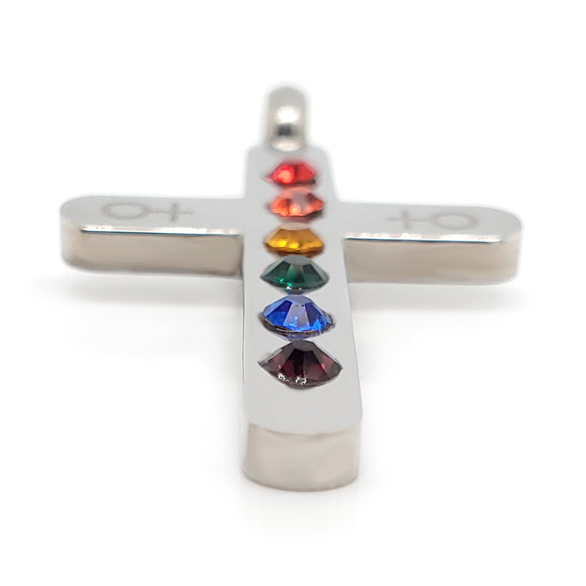 Stainless steel Cubic Zirconia rainbow female Venus symbol Cross pendant at an angle.