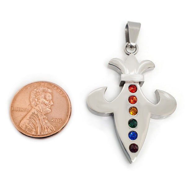 Stainless steel Cubic Zirconia rainbow Fleur de Lis pendant with a penny for scale.