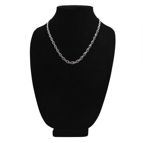 Stainless steel Cross cutout fancy chain necklace on a black velvet bust.