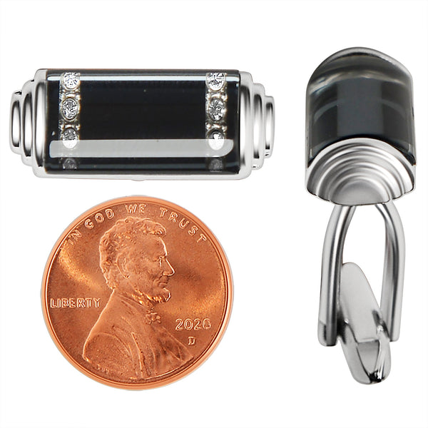 Stainless steel and black rectangle Cubic Zirconia cufflinks with a penny for scale.