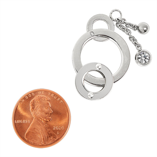 Stainless steel round rings with chain Cubic Zirconia pendant with a penny for scale.