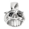 Stainless steel black eyed skull pendant at an angle.