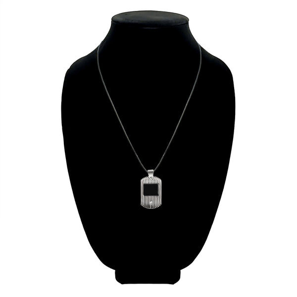 tainless steel grooved Cubic Zirconia dog tag adjustable necklace on a black velvet bust.