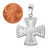 Stainless steel Cubic Zirconia Maltese Cross pendant with a penny for scale.