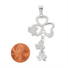 Stainless steel Cubic Zirconia hearts and flowers pendant with a penny for scale.