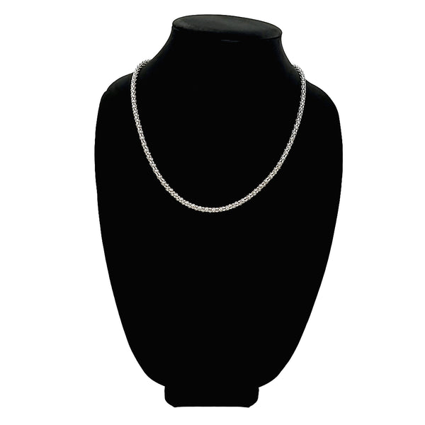Stainless steel popcorn chain necklace on a black velvet bust.