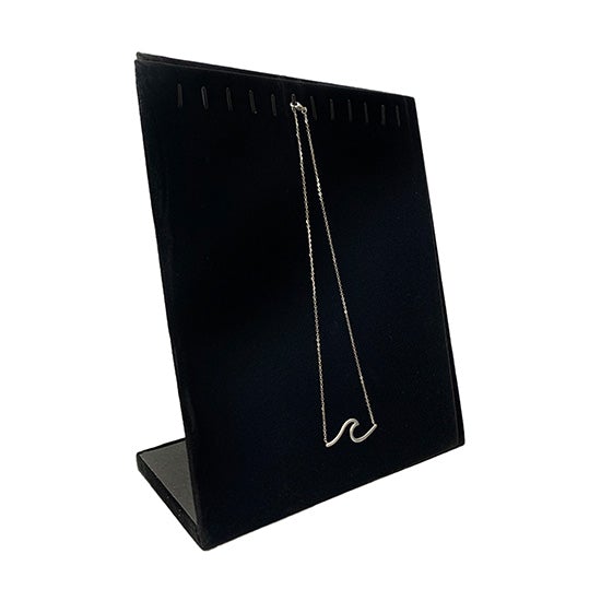 Large black velvet necklace display with a wave necklace on it as an example.